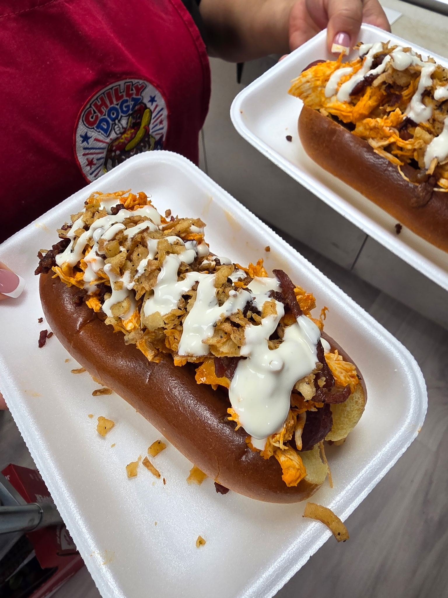 Buffalo Ranch Dog with buffalo chicken, bacon, crispy onions and ranch